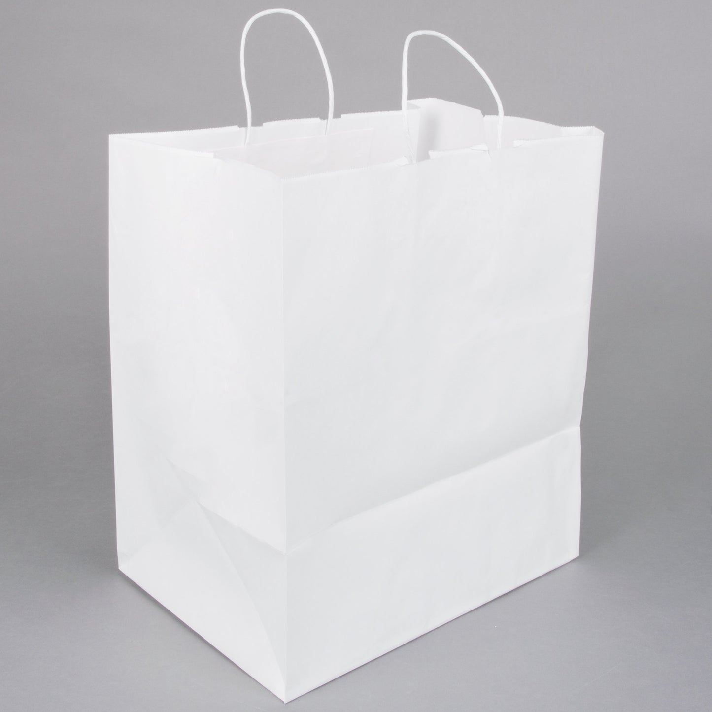 These Eco-friendly 14in x 10in x 15in Duro Bag® 70# White Super Royal Paper Shopping Bags with gusseted flat bottom and paper twist handles are sold 200 per bundle.