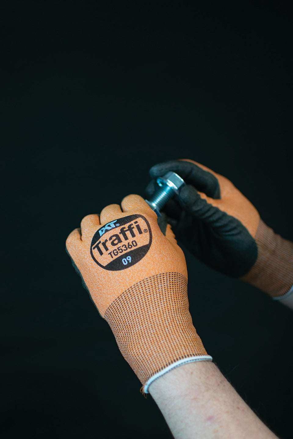 This Eco-friendly Traffi® TG5360 X-Dura LXT® Ultrafine Polyurethane Coated Orange 18-gauge Cut Level A3 Safety Gloves are Carbon Neutral Certified, repels water and oil while providing touchscreen compatibility.