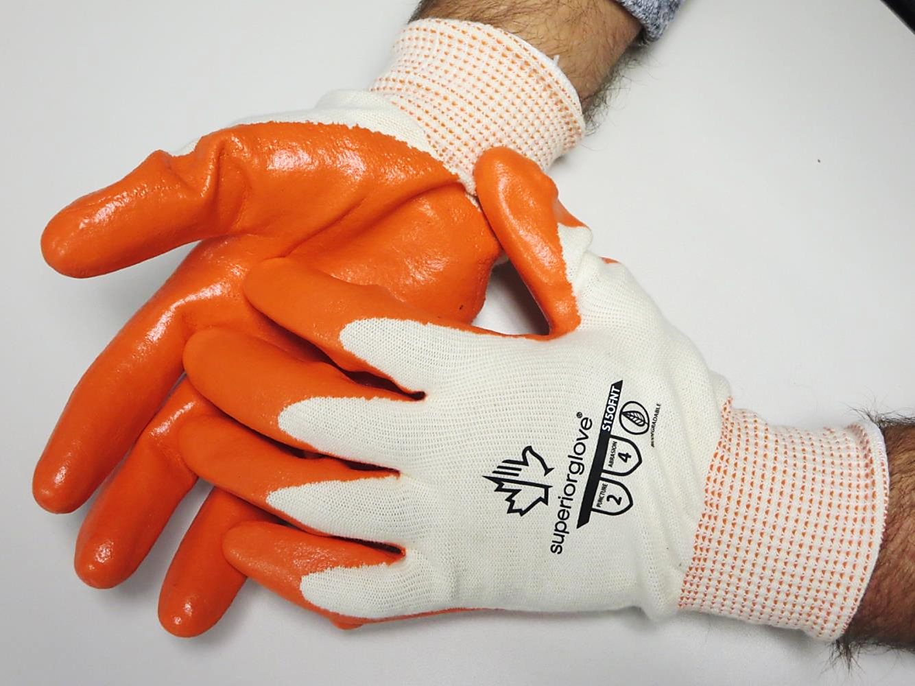 Superior Glove® biodegredable Dexterity® S15OFNT 15-gauge 100% virgin cotton seamless knit work gloves with hi-vis orange foam nitrile coating preserves the planet while providing ANSI rated abrasion and puncture protection.