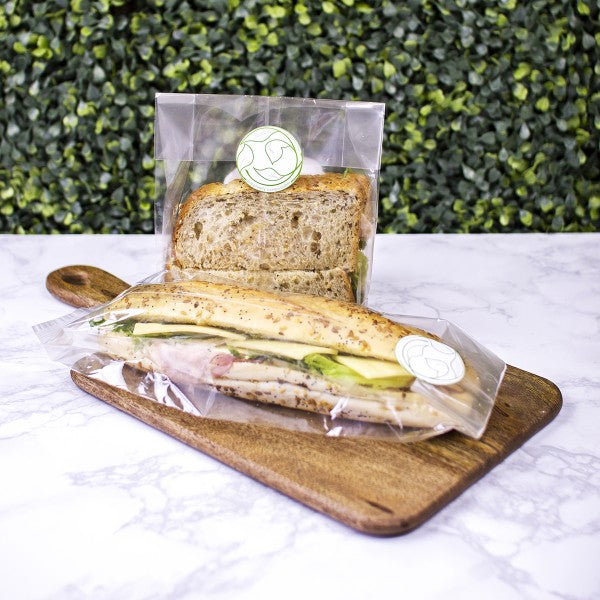 Vegware™ home and commercial compostable clear 4-inch x 2-inch x 14-inch baguette bags are made with grease-proof NatureFlex film that's made from wood pulp.