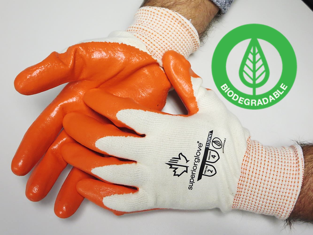 Superior Glove® biodegredable Dexterity® S15OFNT 15-gauge 100% virgin cotton seamless knit work gloves with hi-vis orange foam nitrile coating preserves the planet while providing ANSI rated abrasion and puncture protection.