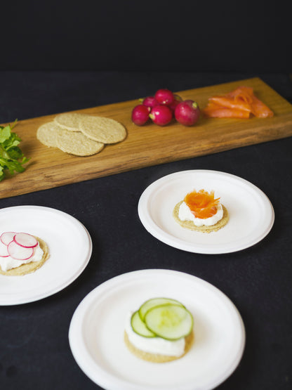 Made from from reclaimed sugarcane, these Vegware™compostable 7-in round plates are good for hot or cold food and they're sturdier than paper plates.