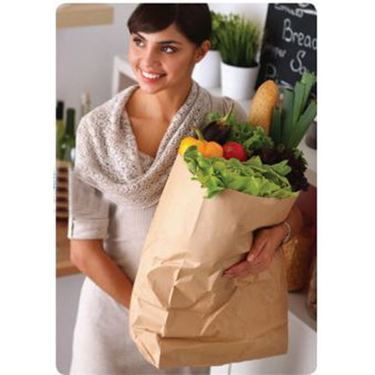 Woman holding a brown paper grocery bag filled with frsh vegetables