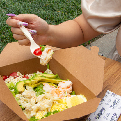 StrawFish Fork scooping a boxed salad 