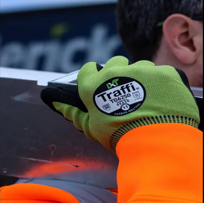 This Eco-friendly Traffi® TG6250 X-Dura LXT® latex  coated Green 15-gauge cut level A5 work gloves are Carbon Neutral certified, repels water and oil with touchscreen compatibility.