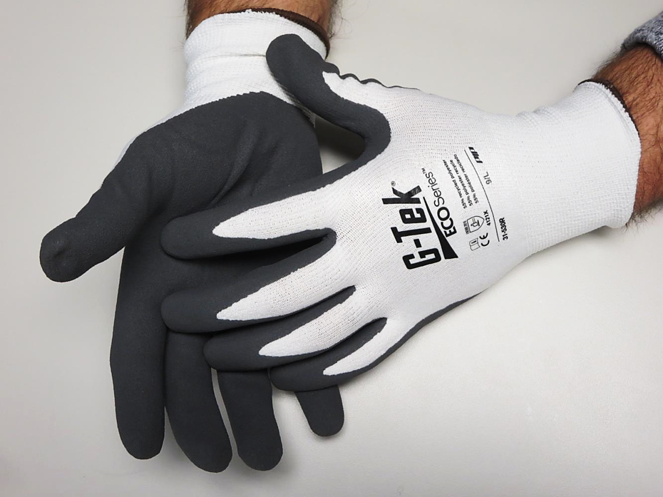 PIP® G-Tek® ECOSeries 31-530R sustainable work gloves with nitrile microsurface palm coating are made bio-based fibers made from recycled P.E.T. water bottles